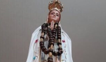 A religious figure with a rosary